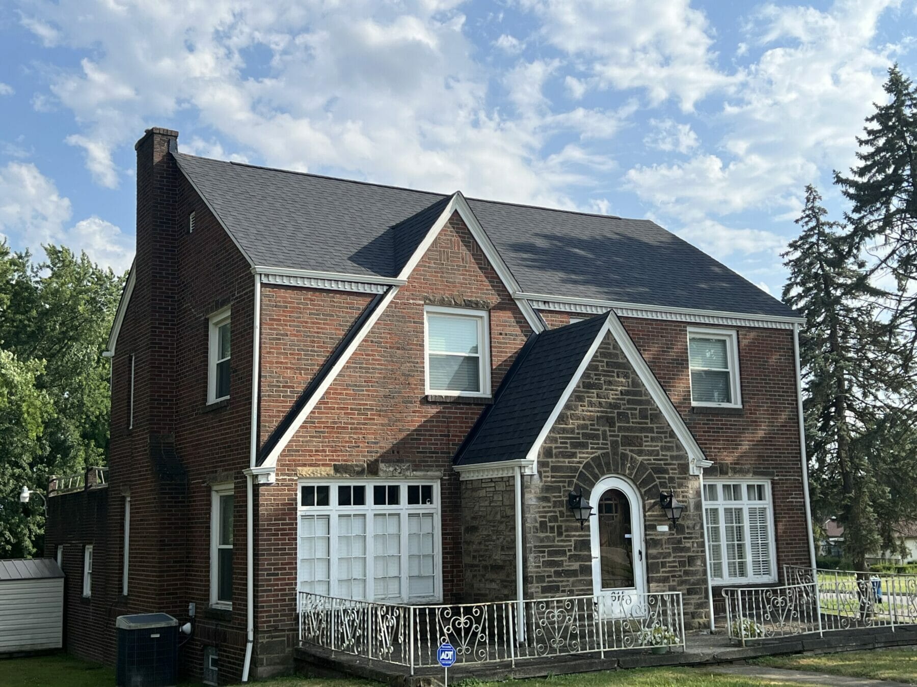 beautiful large home with new asphalt shingle roof installed