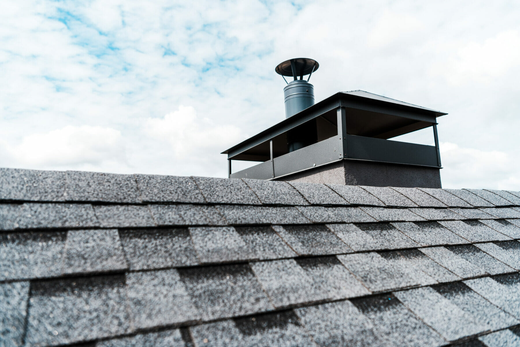 New chimney on asphalt shingle roof